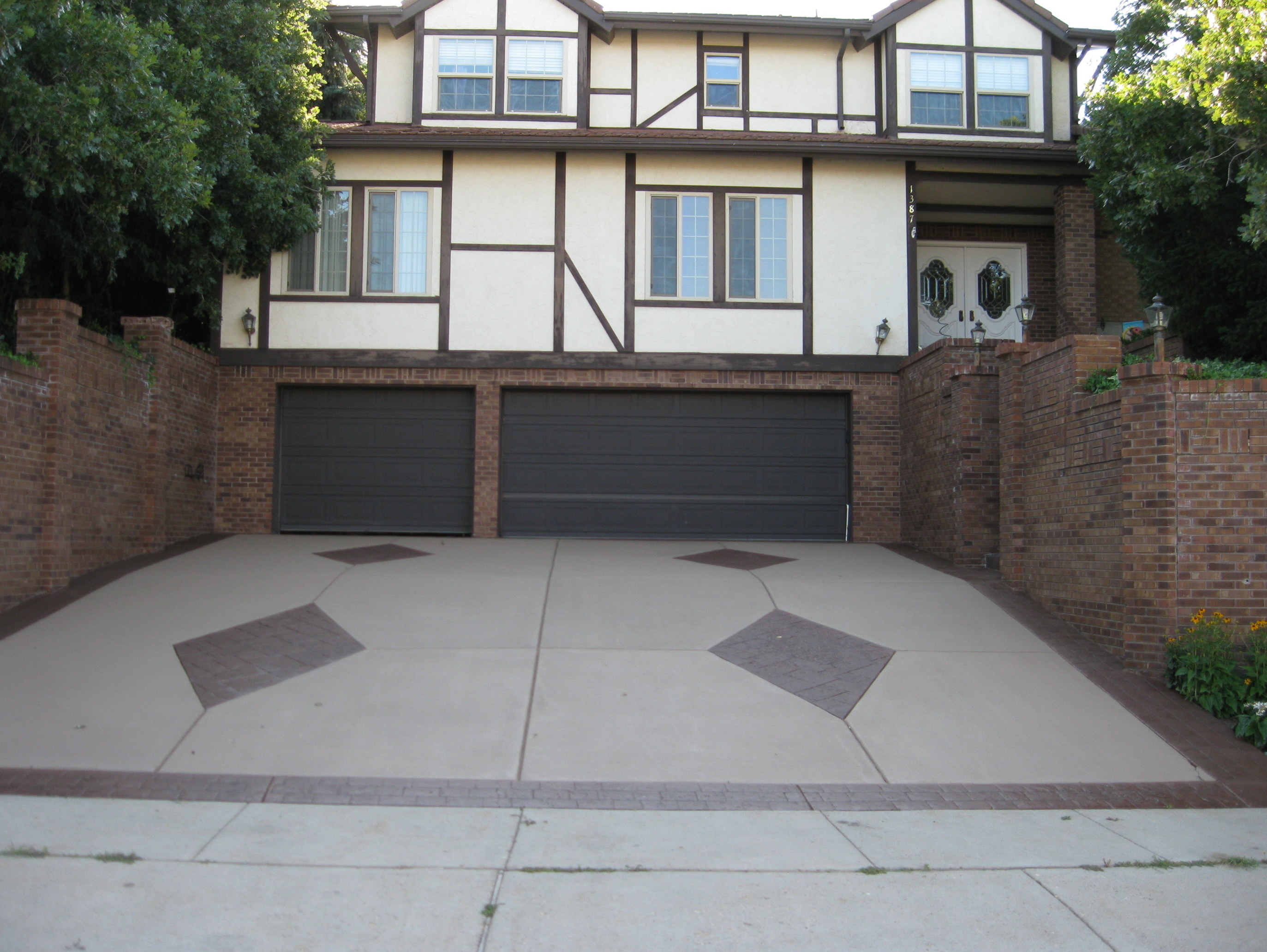 tutor house with brown driveway