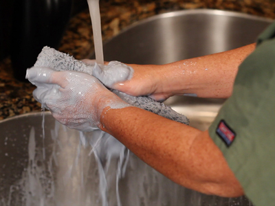 clean paint roller cover in sink